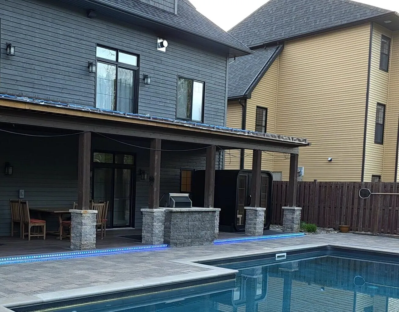 Covered patio and pool deck in daylight