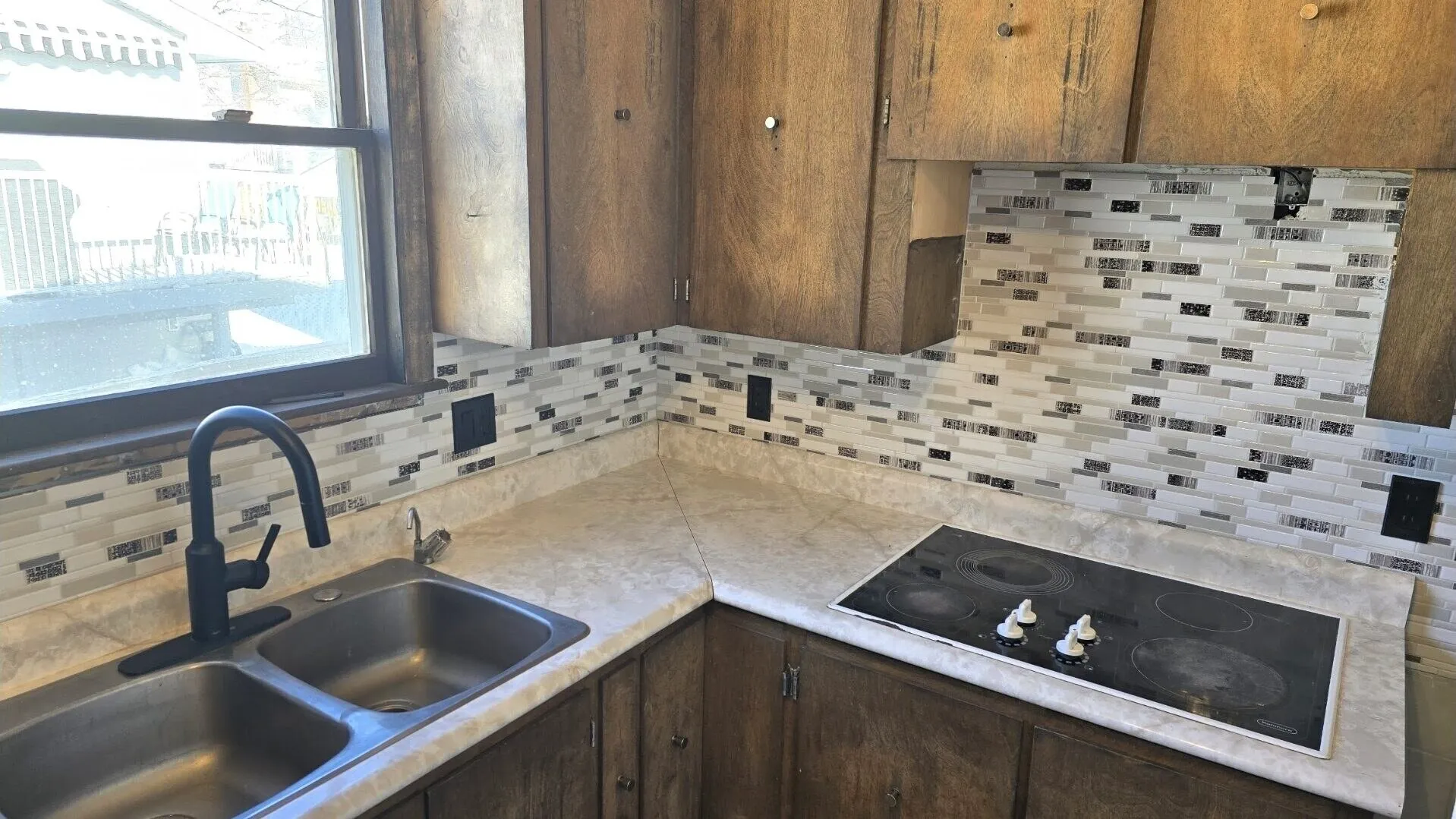 Glass and stone mosaic backsplash
