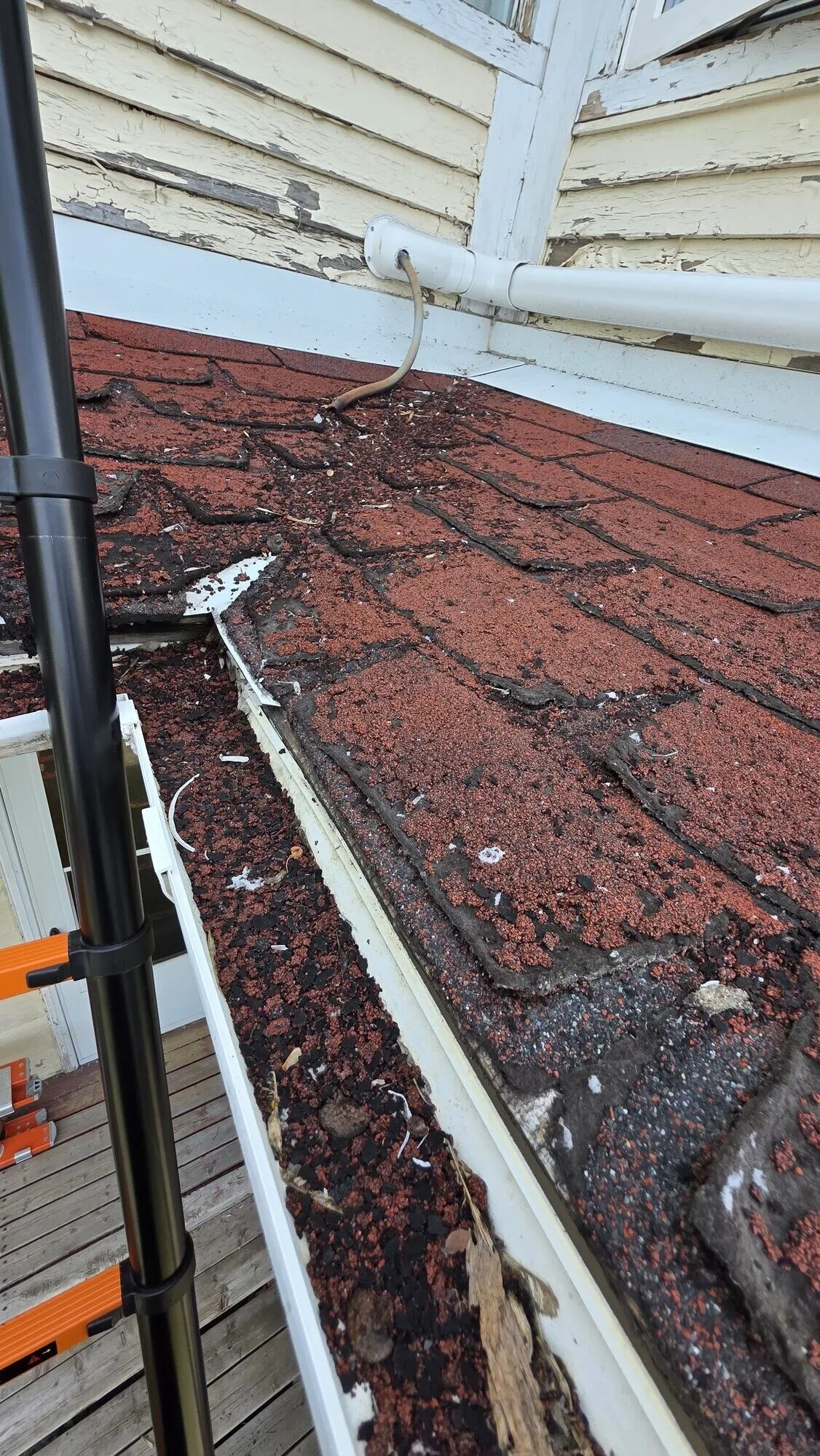 Worn shingles before replacement