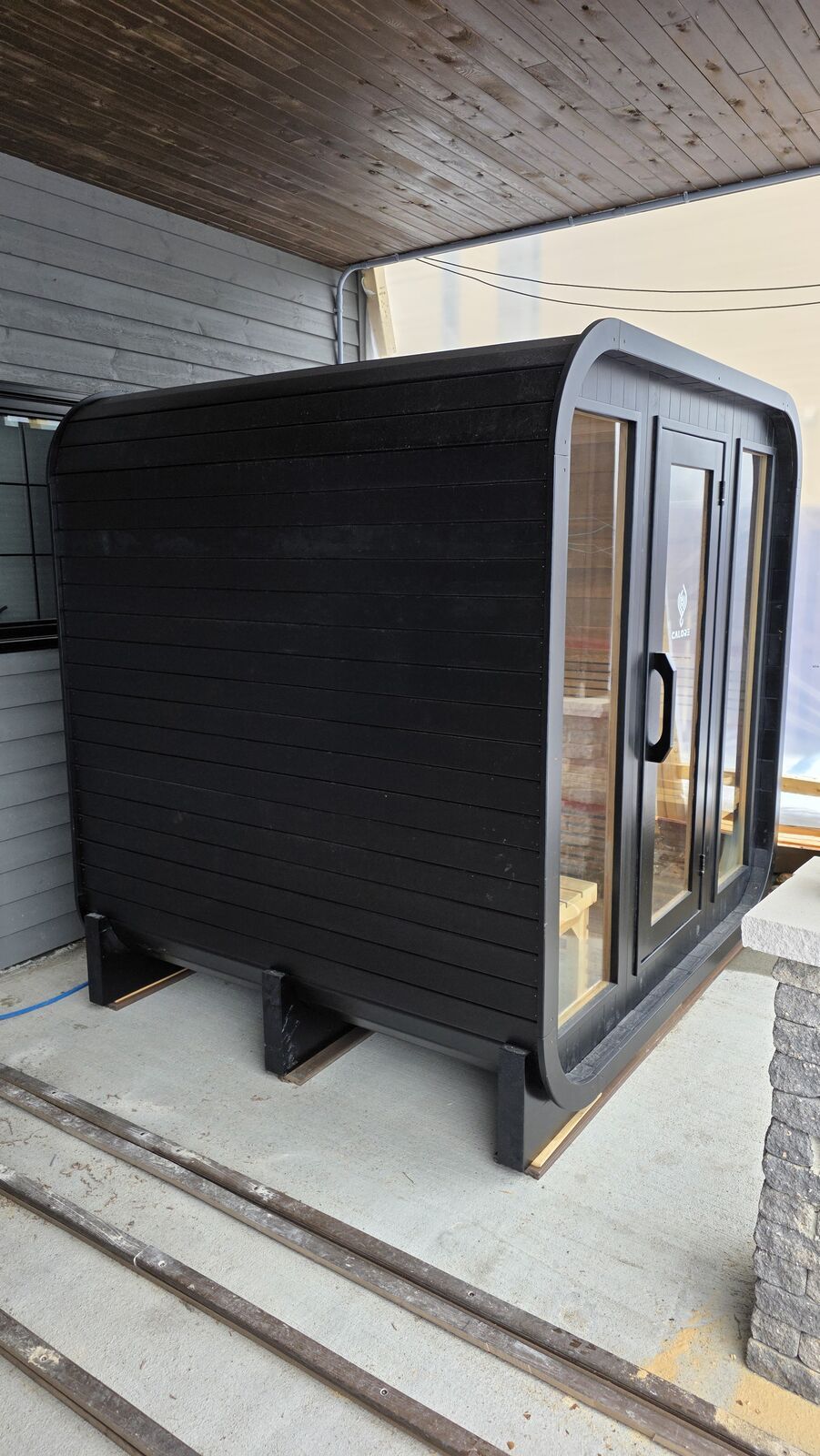 Backyard sauna under the covered patio