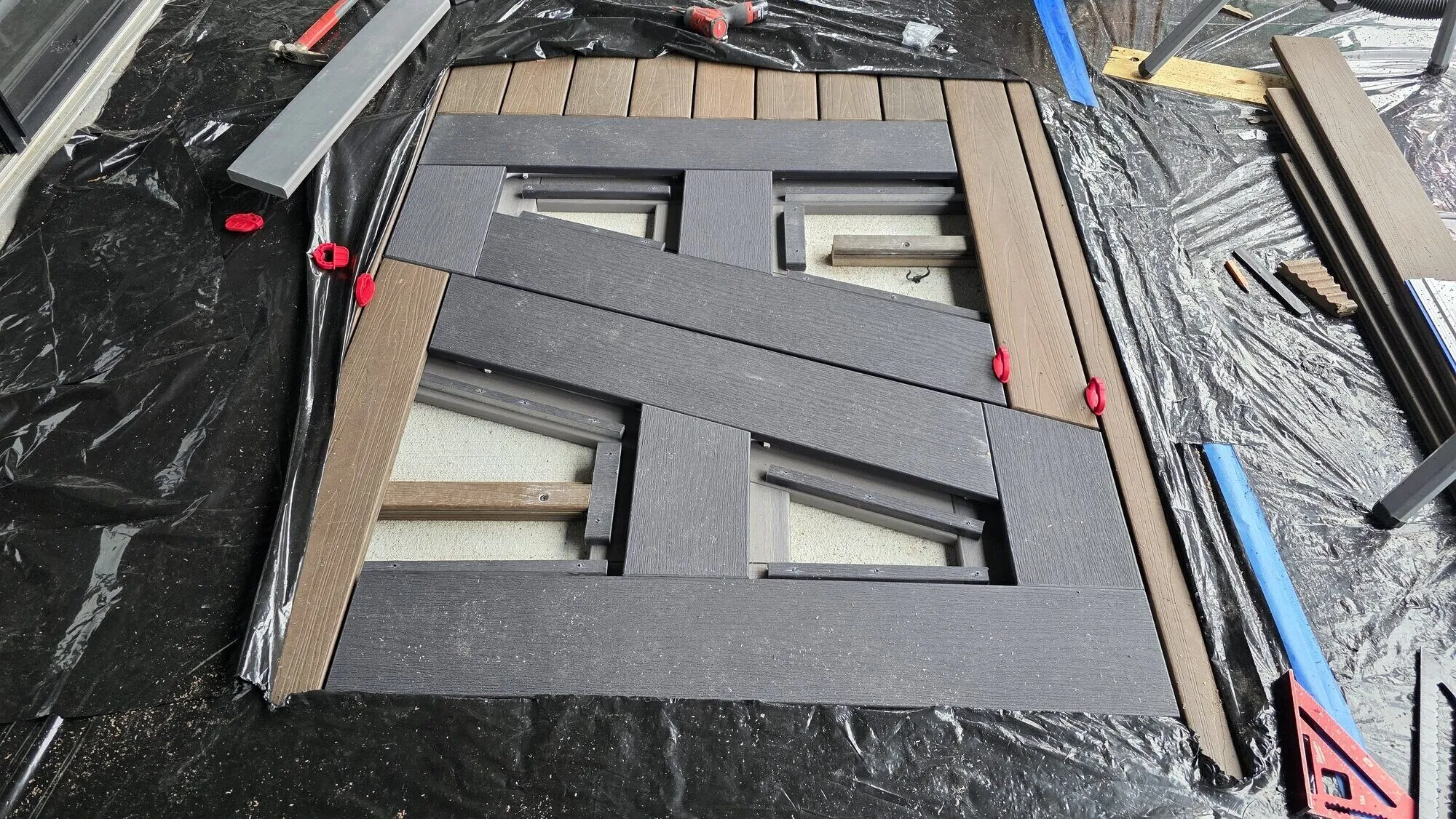 Herringbone boards cut around equipment hatch